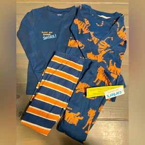 Brand new Carters 5G boys pajamas. Two full sets.